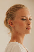 Silver Toned Pearl Huggie Lira Earrings